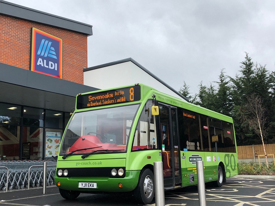 Photo of the number 8 bus parked outside a supermarket