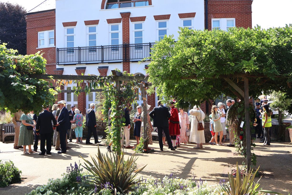 Community gathers at unveiling of plaque at Vine Gardens