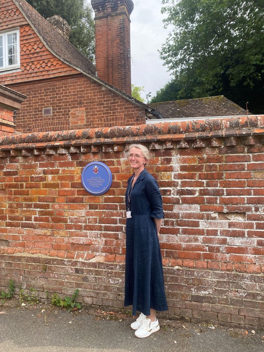 Headmistress Louise Chamberlain with plaque at Walthamstow Hall