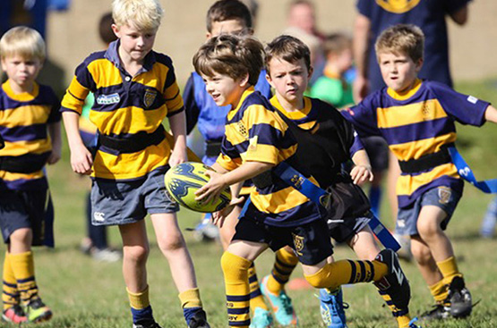 Sevenoaks Rugby Club players running with the ball mid game